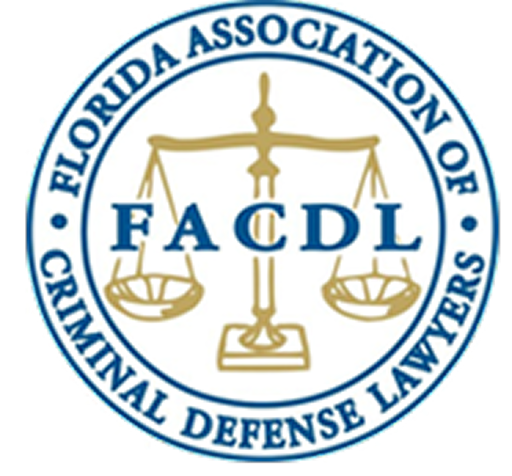 FACDL Logo (Florida Association of Criminal Defense Lawyers) The official circular logo for the Florida Association of Criminal Defense Lawyers (FACDL), featuring the acronym FACDL overlaid on a gold set of scales of justice.